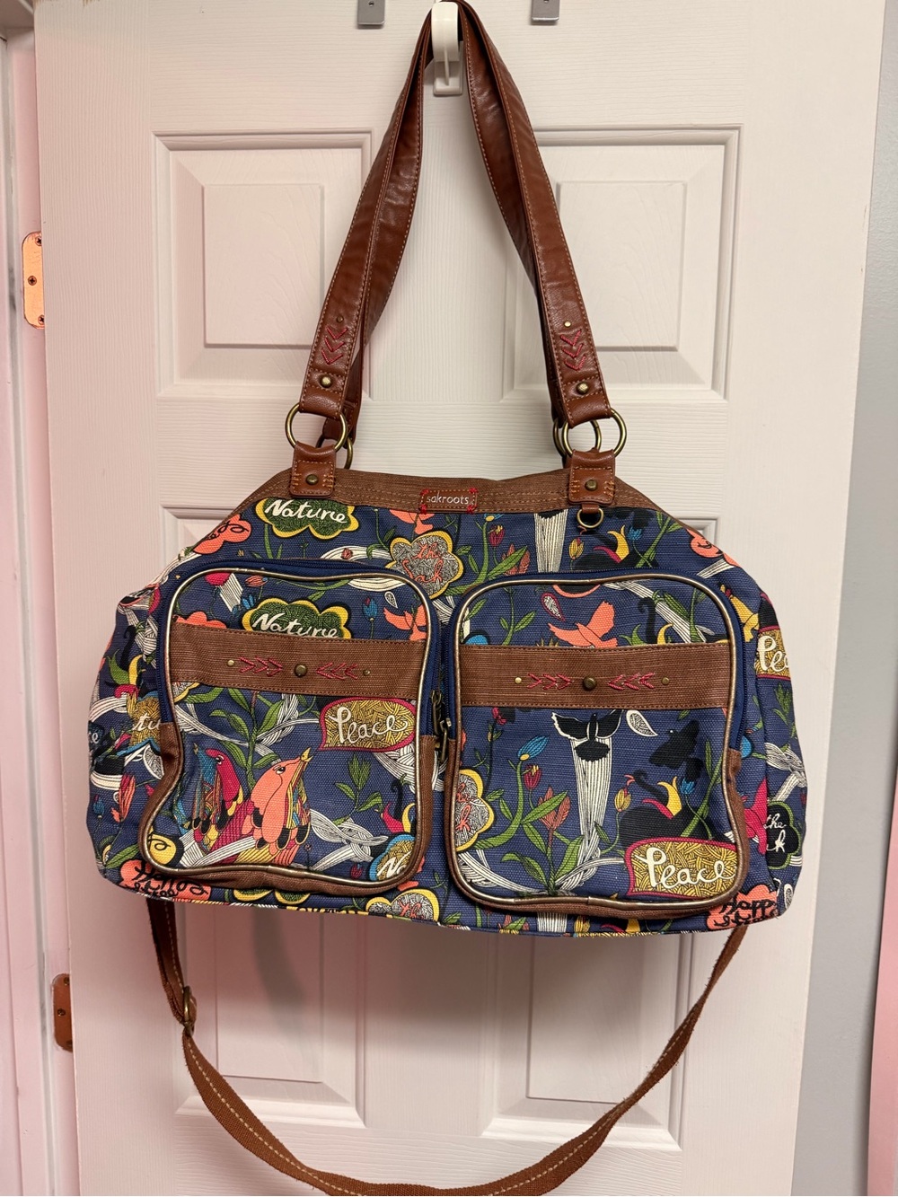 Sakroots Floral Peace Canvas Duffel Bag in Navy with Brown Trim